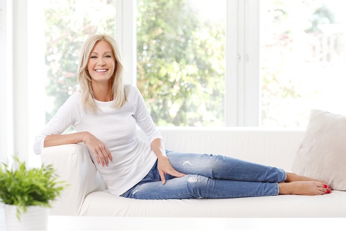 Woman reclining on couch