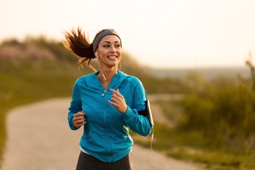 Dedicated,Athletic,Woman,Running,In,Nature,And,Dawn.