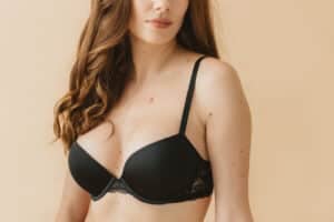 Woman smiling after breast surgery recovery