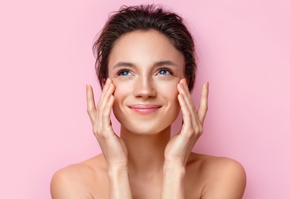 Woman smiling with smooth, glowing skin after Botox treatment